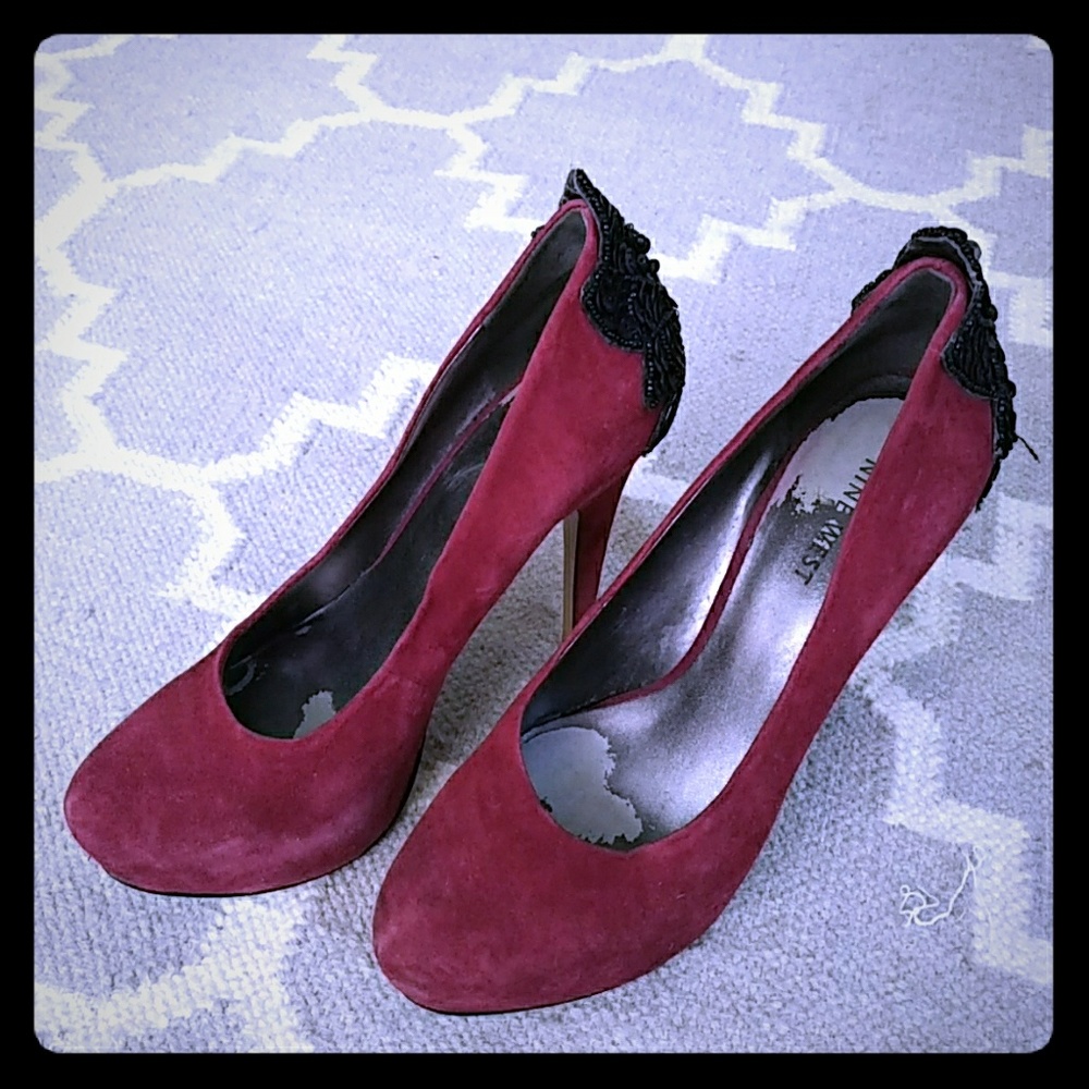 Red pumps with black jewels on the back of pumps f